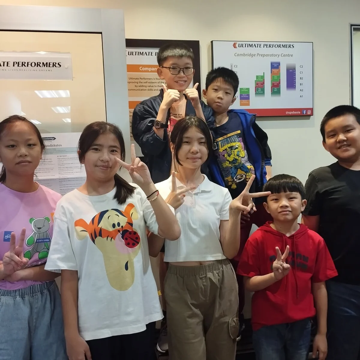 a warm classroom moment, tutor with students
